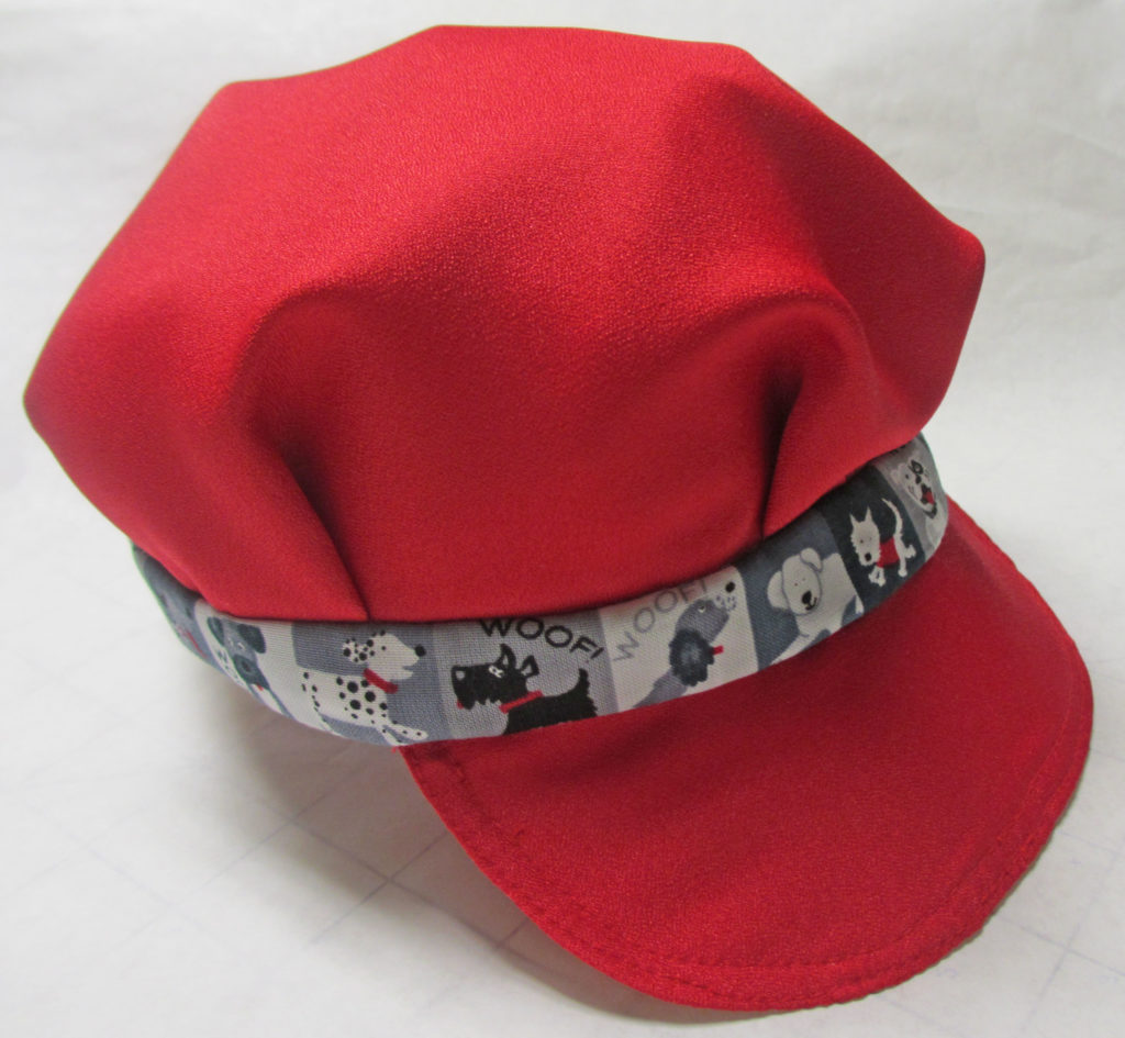 Cap finishes the baby boy's outfit.